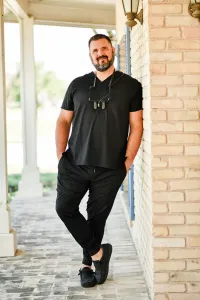 Dr. Panos posing outside of office building
